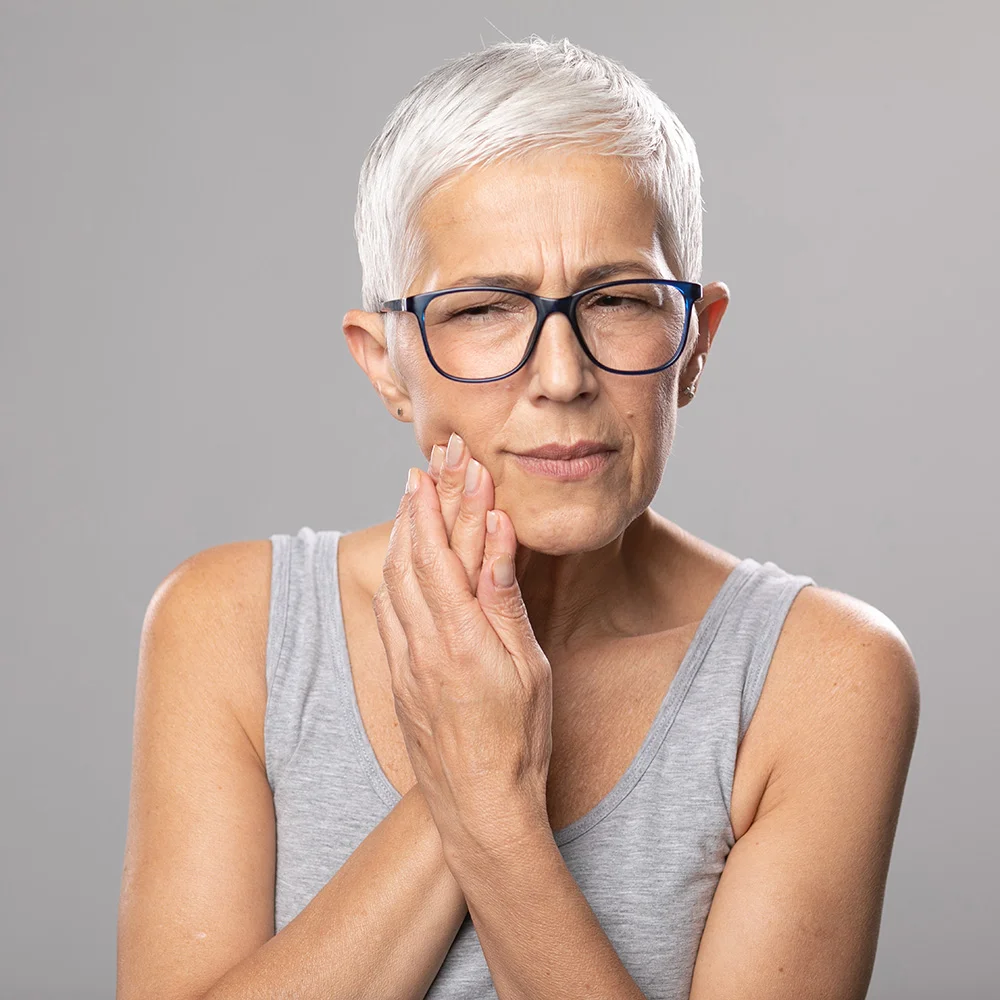 Toothache. pain tooth in mouth, old woman with short gray hair and toothache problems, diabetes