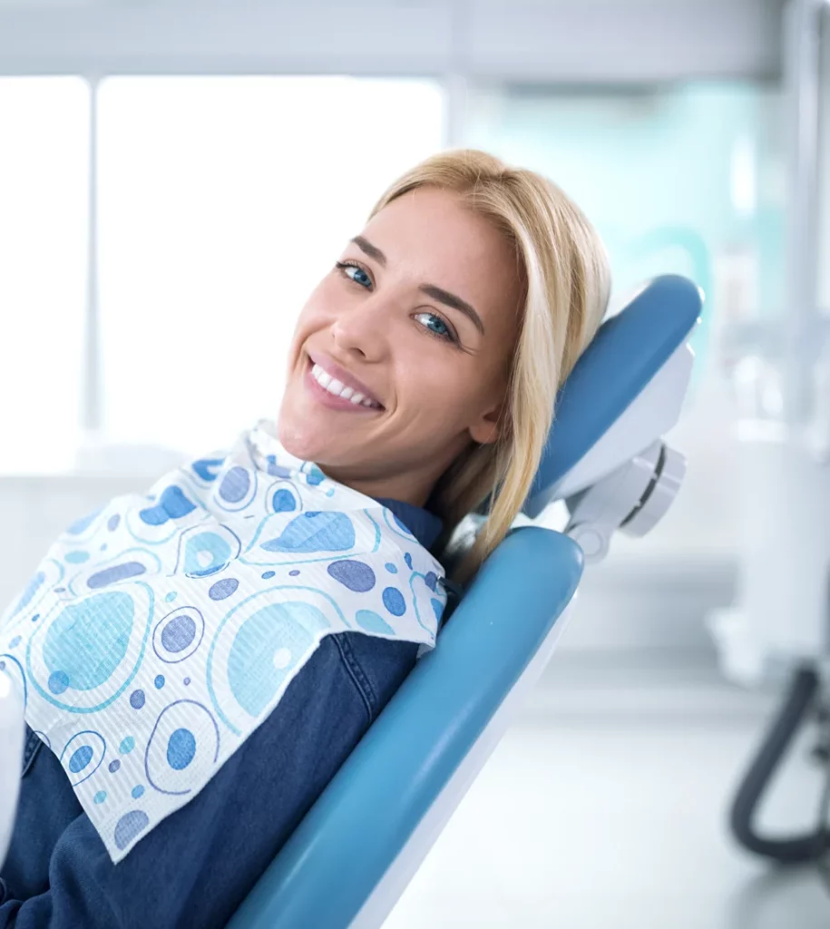 Smiling and satisfied patient in a dental office